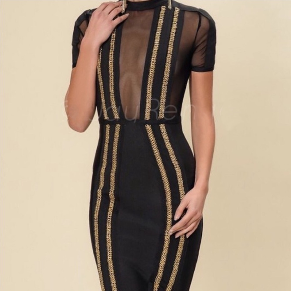Half sheer and bandage black dress with gold hardware.